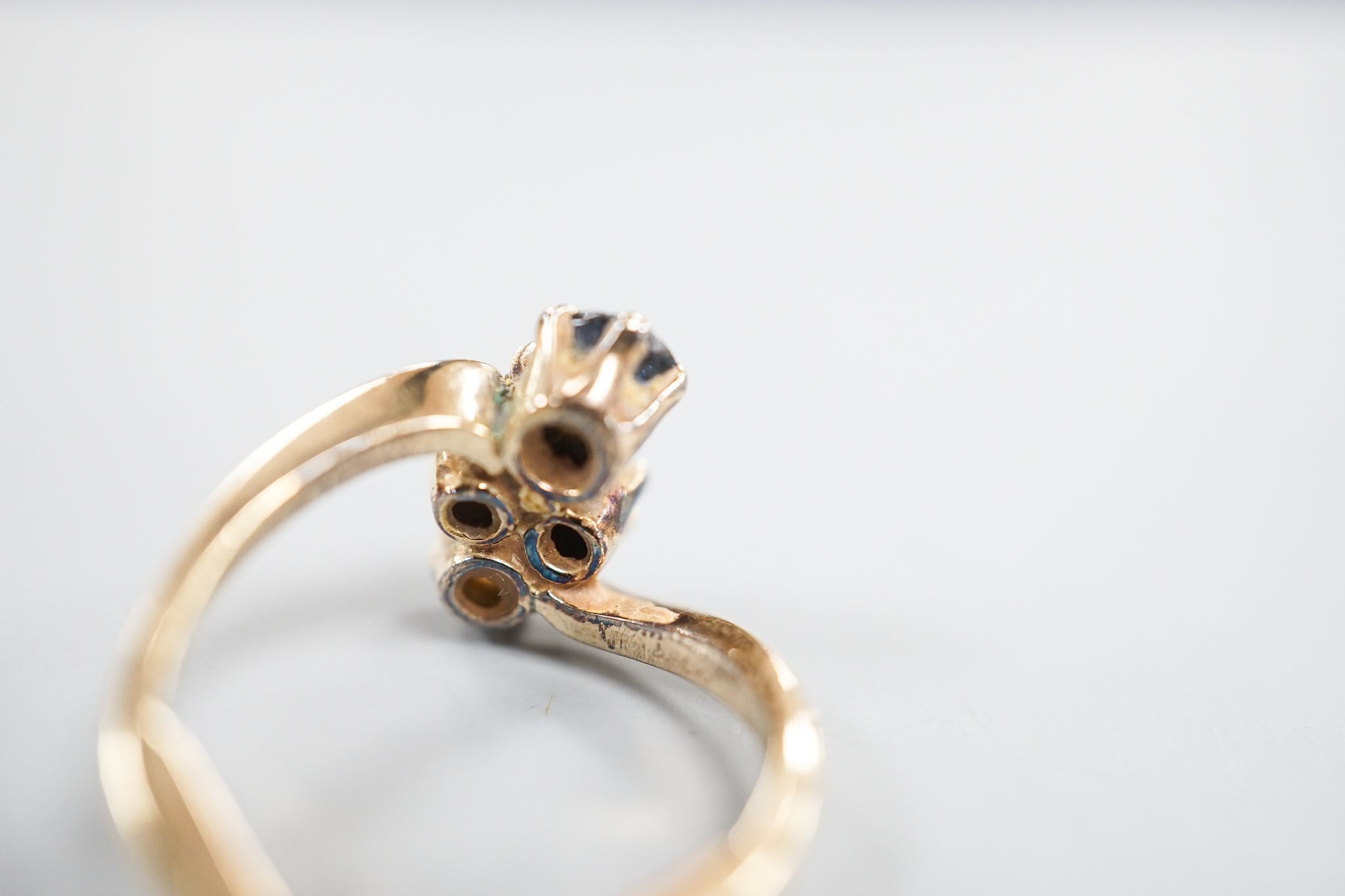 A yellow metal, sapphire an diamond set four stone dress ring, size L, gross 3.4 grams.